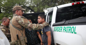 Members of the Border Patrol Search, Trauma, and Rescue Unit near Falfurrias, Texas, apprehend an immigrant from Guatemala June 19. Pope Francis told Reuters he stands with the U.S. bishops in their condemnation of the Trump administration's immigration policy has led to children being held in government shelters while their parents are detained in federal prison. (CNS photo/Adrees Latif, Reuters)