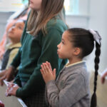Good Shepherd Catholic School students pray during Mass. Dialog photo/Don Blake